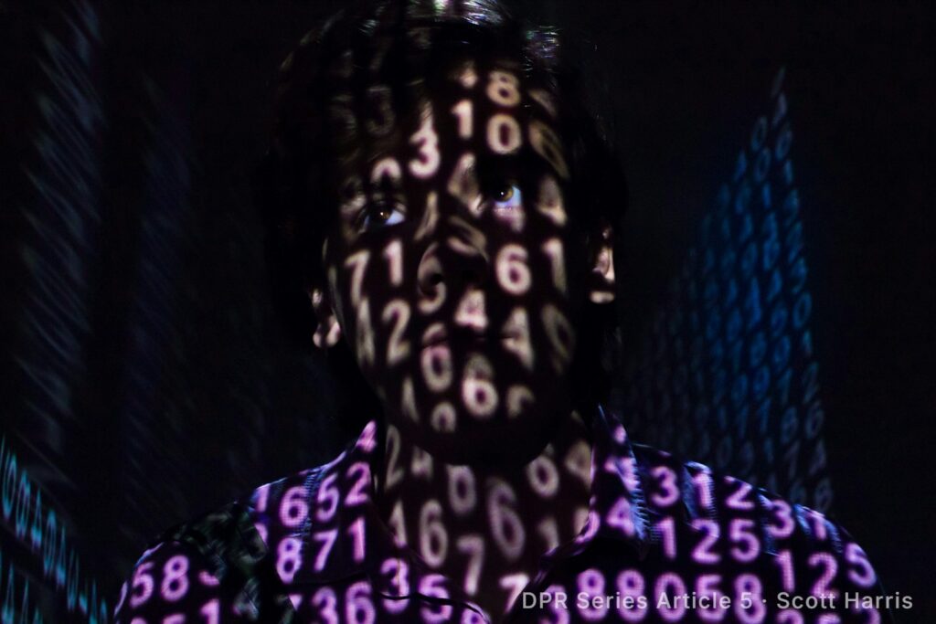 Person with glowing numbers projected across their face in the dark