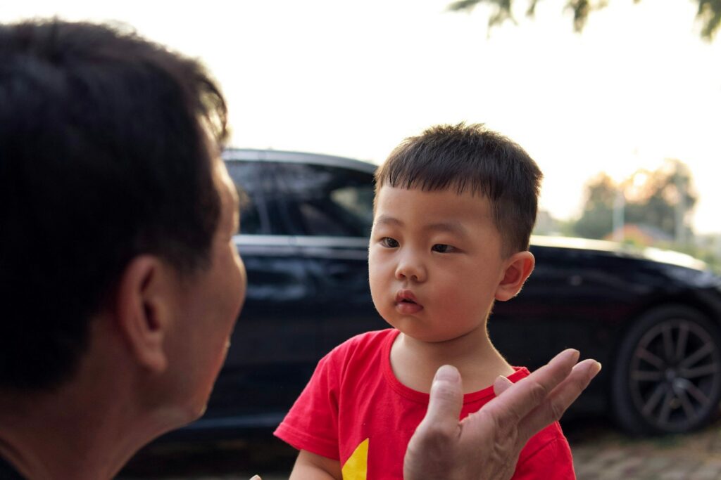 A father telling his young son a story